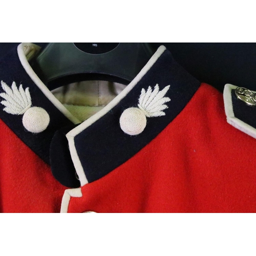 231 - A British military Grenadier Guards tunic complete with Queens crown  buttons and badges.