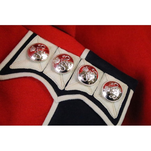 231 - A British military Grenadier Guards tunic complete with Queens crown  buttons and badges.