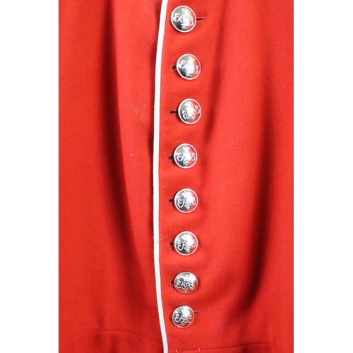 231 - A British military Grenadier Guards tunic complete with Queens crown  buttons and badges.
