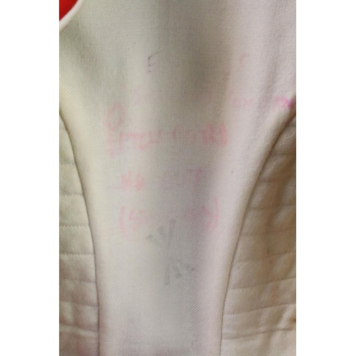 231 - A British military Grenadier Guards tunic complete with Queens crown  buttons and badges.