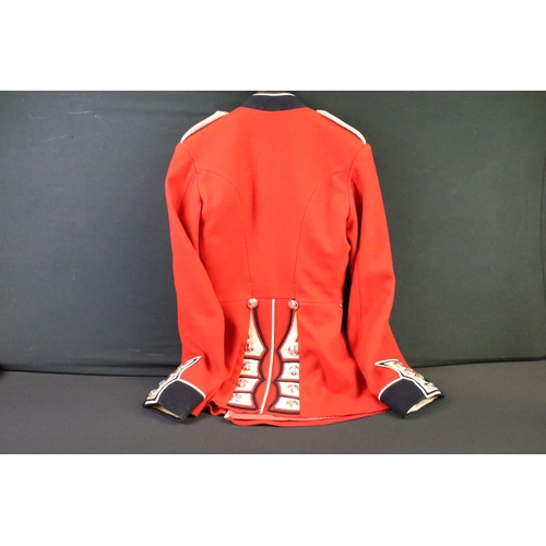 231 - A British military Grenadier Guards tunic complete with Queens crown  buttons and badges.