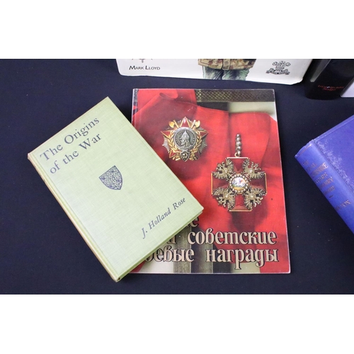 234 - A large collection of military reference books to include Badge, Button, Medal and sword examples.