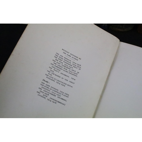 234 - A large collection of military reference books to include Badge, Button, Medal and sword examples.