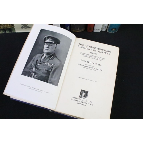 234 - A large collection of military reference books to include Badge, Button, Medal and sword examples.