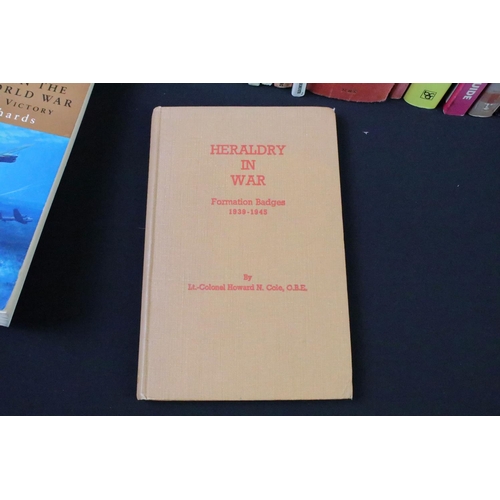 237 - A large collection of military reference books to include Badge, Button, Medal and uniform examples.