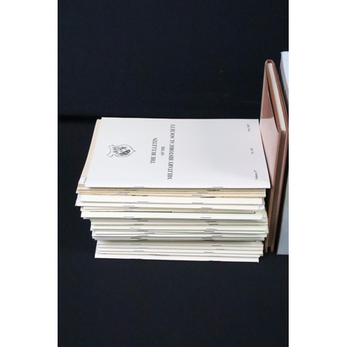 237 - A large collection of military reference books to include Badge, Button, Medal and uniform examples.