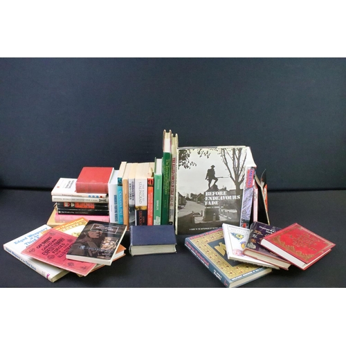 239 - A large collection of military reference books to include Badge, Uniform and World War Two examples.