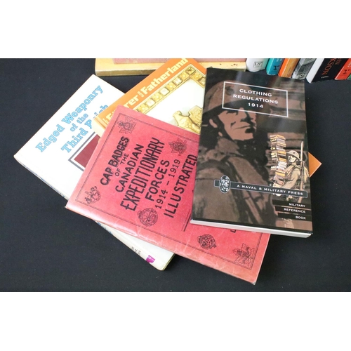 239 - A large collection of military reference books to include Badge, Uniform and World War Two examples.