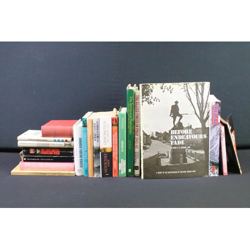 239 - A large collection of military reference books to include Badge, Uniform and World War Two examples.