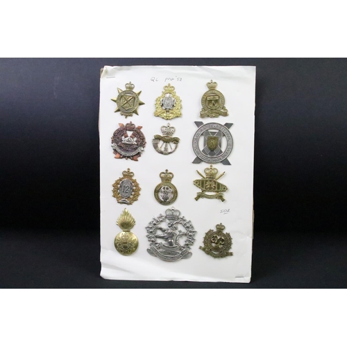 34 - A collection of Canadian Military Queens crown cap badges to include the West Nova Scotia Regiment, ... 