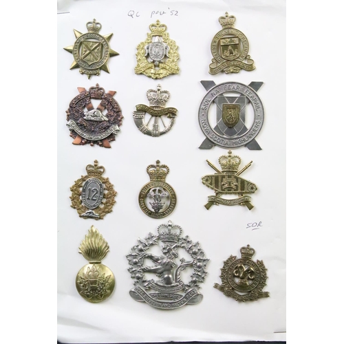 34 - A collection of Canadian Military Queens crown cap badges to include the West Nova Scotia Regiment, ... 