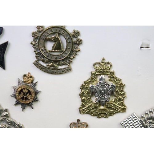 35 - A collection of Canadian Military Queens crown cap badges to include The Canadian Officers Training ... 