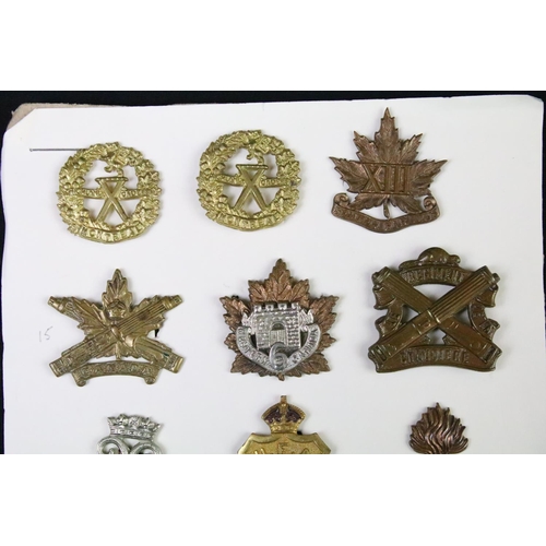 36 - A collection of Canadian military collar badges to include World War Two King Crown issues, brass, b... 