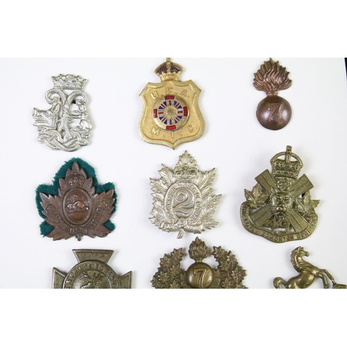 36 - A collection of Canadian military collar badges to include World War Two King Crown issues, brass, b... 