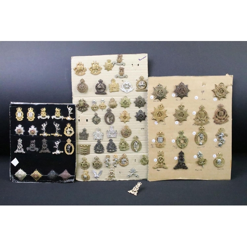 41 - A collection of British military regimental cap and collar badges to include the Army Service Corps,... 