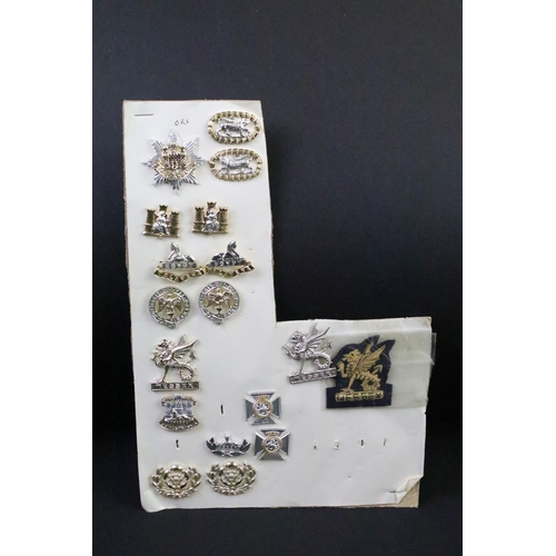 44 - A collection of British military regimental cap and collar badges to include the Somerset Light Infa... 