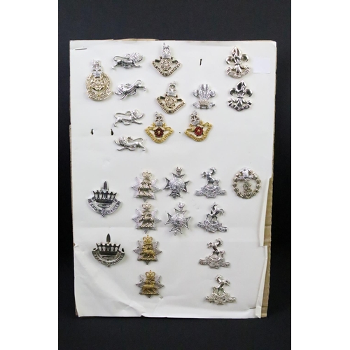 44 - A collection of British military regimental cap and collar badges to include the Somerset Light Infa... 