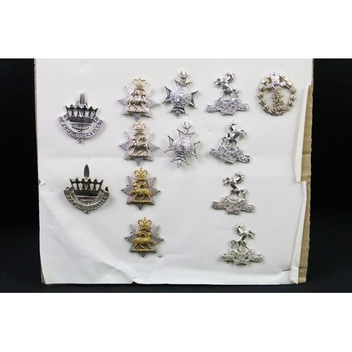 44 - A collection of British military regimental cap and collar badges to include the Somerset Light Infa... 