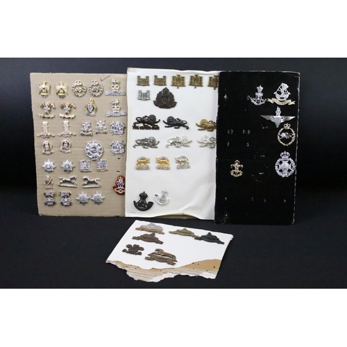 46 - A collection of British military regimental cap and collar badges to include the Lincolnshire regime... 