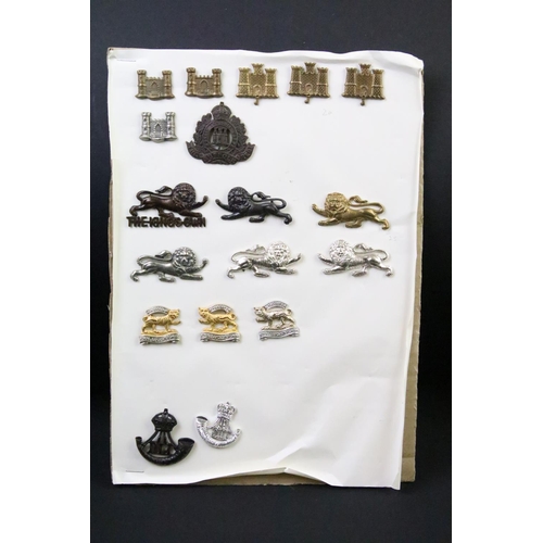 46 - A collection of British military regimental cap and collar badges to include the Lincolnshire regime... 