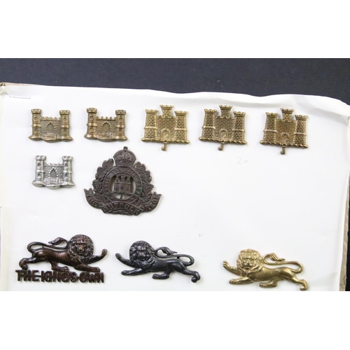 46 - A collection of British military regimental cap and collar badges to include the Lincolnshire regime... 