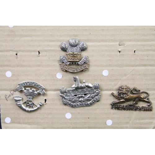 47 - A collection of British military Regimental cap and collar badges to include the Duke of Edinburghs ... 