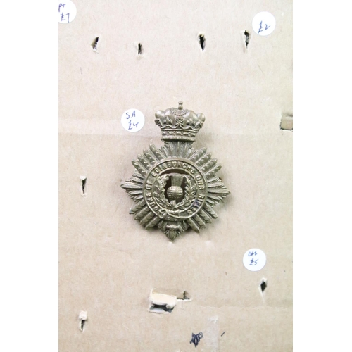 47 - A collection of British military Regimental cap and collar badges to include the Duke of Edinburghs ... 