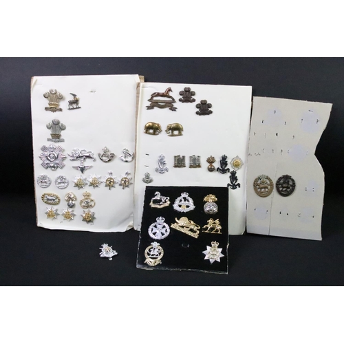 48 - A collection of British military Regimental cap and collar badges to include The West Yorkshire Regi... 