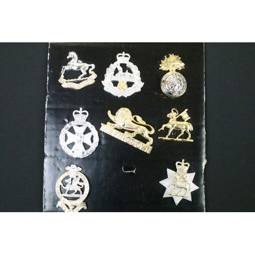 48 - A collection of British military Regimental cap and collar badges to include The West Yorkshire Regi... 