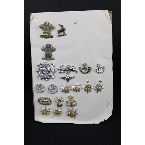 48 - A collection of British military Regimental cap and collar badges to include The West Yorkshire Regi... 