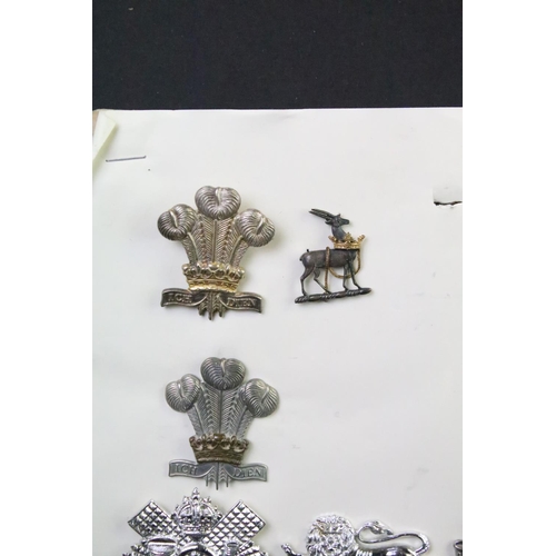 48 - A collection of British military Regimental cap and collar badges to include The West Yorkshire Regi... 