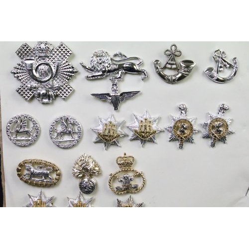 48 - A collection of British military Regimental cap and collar badges to include The West Yorkshire Regi... 