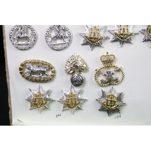 48 - A collection of British military Regimental cap and collar badges to include The West Yorkshire Regi... 