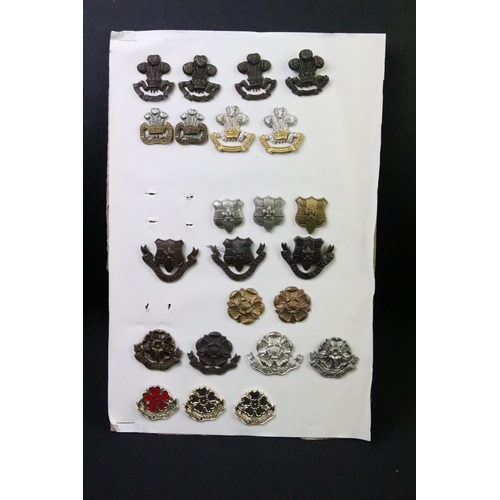 49 - A collection of British military Regimental cap and collar badges to include the East Lancashire Reg... 