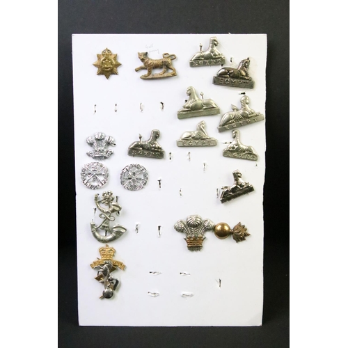 49 - A collection of British military Regimental cap and collar badges to include the East Lancashire Reg... 