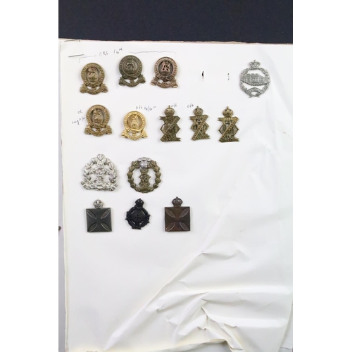 50 - A collection of British military Regimental cap and collar badges to include the Yorkshire Regiment,... 