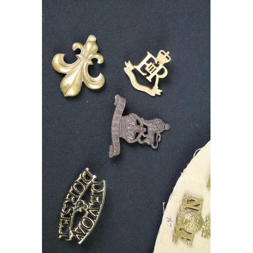 51 - A collection of mainly British military Regimental cap and collar badges to include the 9th Lancers,... 