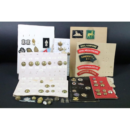 52 - A collection of British Military Cloth badges, trade badges, shoulder titles, buttons and sweetheart... 