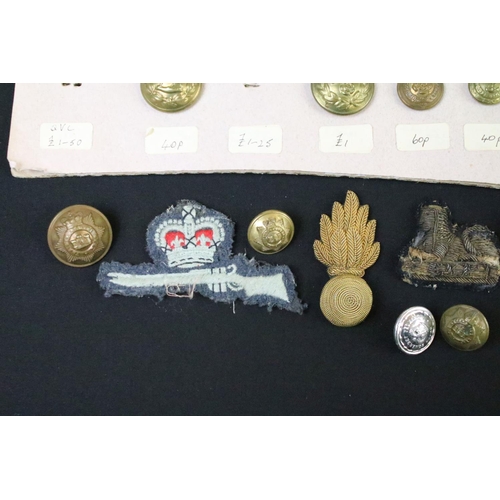 52 - A collection of British Military Cloth badges, trade badges, shoulder titles, buttons and sweetheart... 