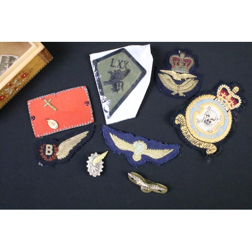 59 - A collection of mainly British Royal Air Force cloth badges to include a bomber brevet.