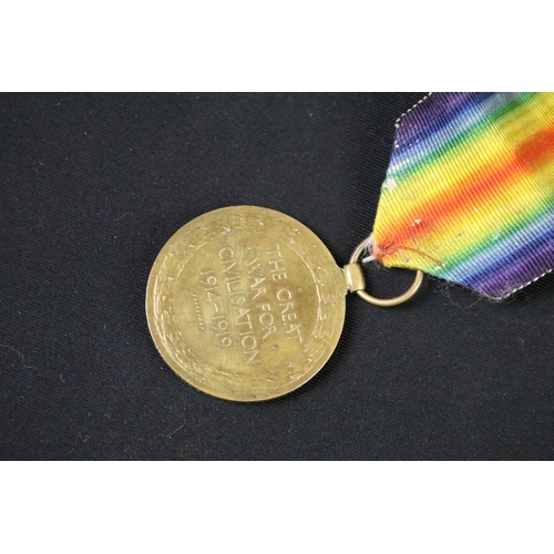 61 - A British World war One full size medal pair to include the 1914-1918 British war medal and the Vict... 