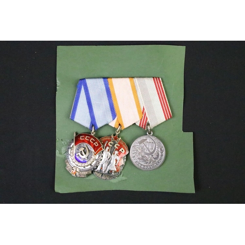 69 - A group of three Russian / CCCP medals to include the order of the red banner.