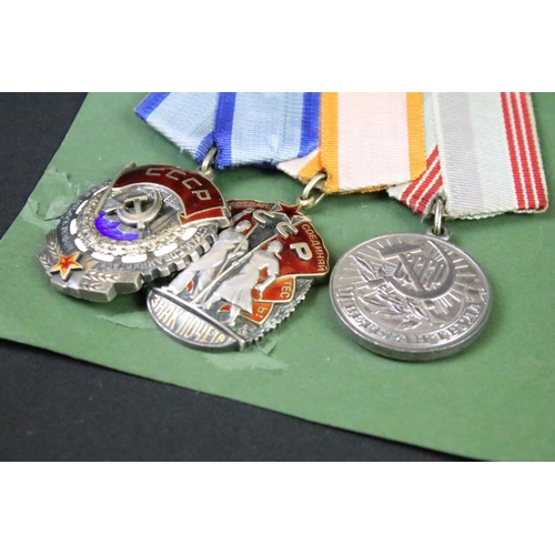 69 - A group of three Russian / CCCP medals to include the order of the red banner.