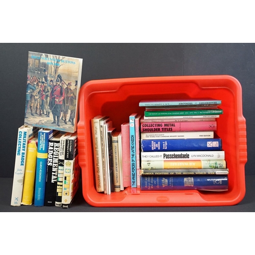 236 - A large collection of military reference books to include Badge, Button, Medal and sword examples.