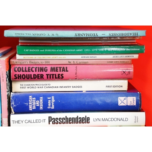 236 - A large collection of military reference books to include Badge, Button, Medal and sword examples.
