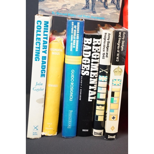236 - A large collection of military reference books to include Badge, Button, Medal and sword examples.