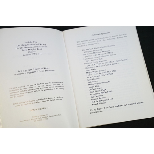 236 - A large collection of military reference books to include Badge, Button, Medal and sword examples.