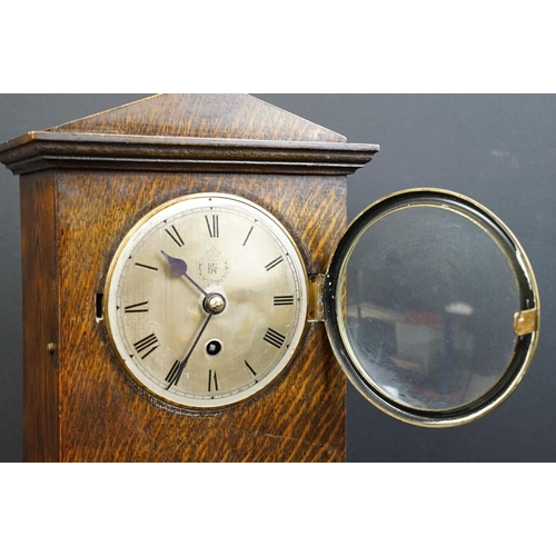 122 - A World War Two wooden cased chiming mantle clock, the face etched with the badge of the RAF / Royal... 