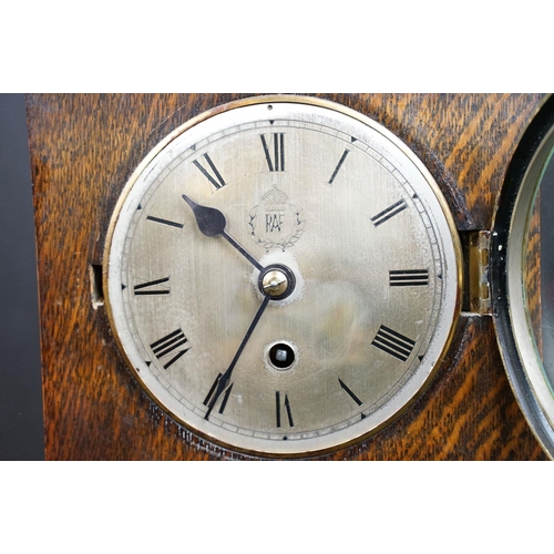 122 - A World War Two wooden cased chiming mantle clock, the face etched with the badge of the RAF / Royal... 