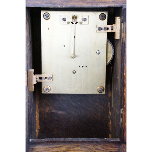 122 - A World War Two wooden cased chiming mantle clock, the face etched with the badge of the RAF / Royal... 